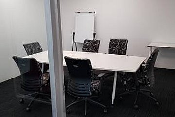 Hydrostor, boatshape boardroom table with radius corners and Mano white frame