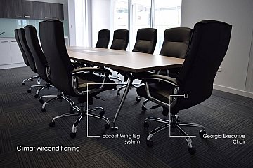 Climat Air-conditioning, boatshape boardroom table with leather inlay power dock and Eccosit Wing polished frame