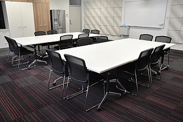 Charles Campbell College, Modulus flip tables with sled base Spencer chairs