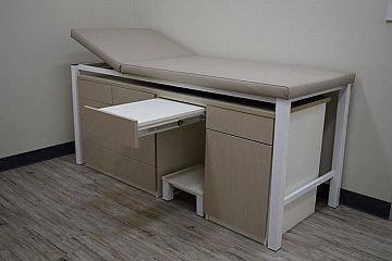 City Clinic, custom adjustable examination table with pull-out shelf, storage & step stool