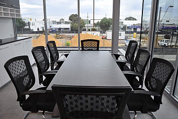 Hindmarsh Medical Centre, Blackend Linewood rectangular boardroom table and Eccosit Wing polished frame