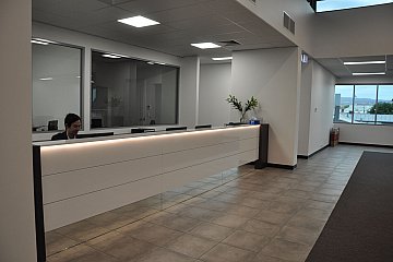 Hindmarsh Medical, Apex Gloss Counter with mirrored kicker & feature LED strip lighting