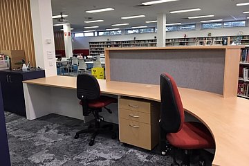Mitcham Girls, curved circulation desk in Young Beech/White 200 with internal acoustic pinboard hob