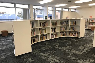 Mitcham Girls, mobile curved and straight library shelving in Laminex White 200