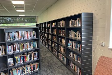 Grant High School, wall mount straight library shelving with slat wall end in Laminex Battalion