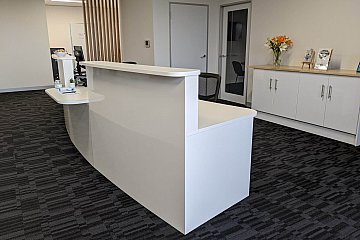 Custom locally manufactured gloss curved reception counter