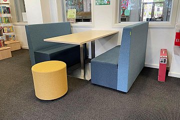 Upholstered booth seating and Rondo ottoman