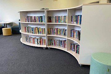 Locally manufactured curved library shelving